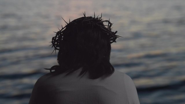 Jesus with crown of thorns on head in slow motion
