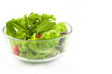 fresh spring green salad with lettuce in glass bowl 