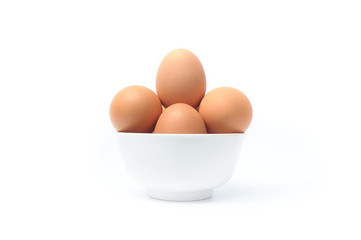 hen eggs in bowl on white background