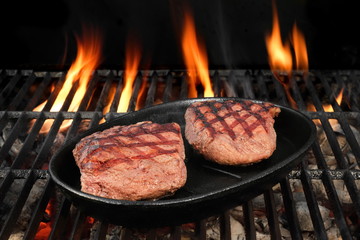 Two Beef Steaks On The Hot BBQ Flaming Grill