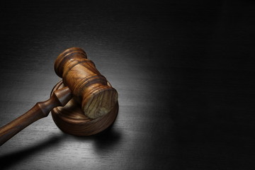 Real Judges Or Auctioneer Gavel On The Black Wooden Table
