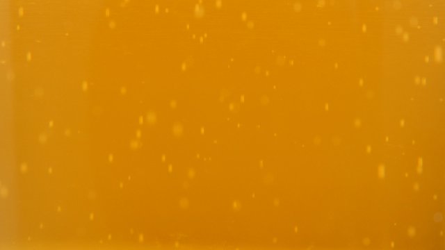 Glass full of beer slow tilt bubbles and foam 4K 2160p UltraHD footage - Golden color of fresh beer bubbles 4K 3840X2160 UHD video 
