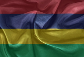 Waving flag of Mauritius. Flag has real fabric texture