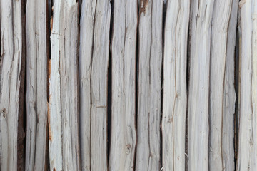 firewood in concatenation to wood background.