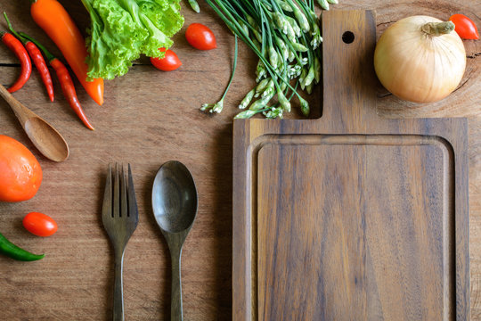 Fresh ingredients for cooking on wooden table background