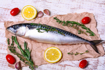 ingredients for baking scomber fillets, include raw mackerel, lemon, garlic, rosemary