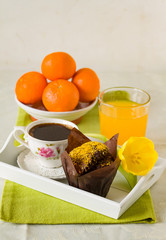 Festive sweet breakfast with coffee, muffin and fruits