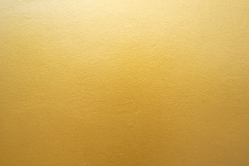 Fototapeta premium Gold concrete wall on background texture.
