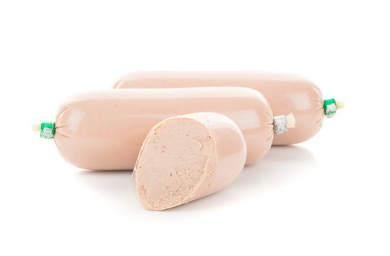 Portions of liver pate on a white background