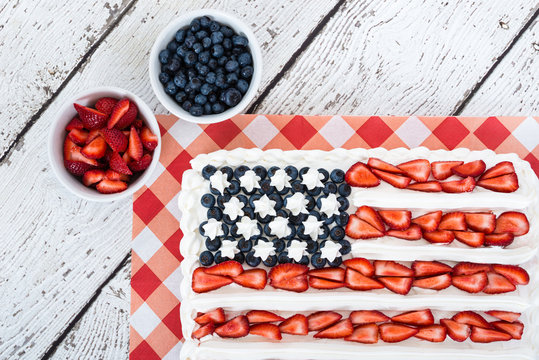 Patriotic American flag cake with blueberries and strawberries