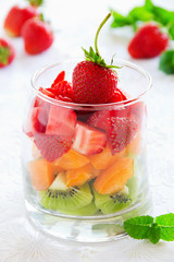 Fruit salad of strawberries, kiwis and apricots.