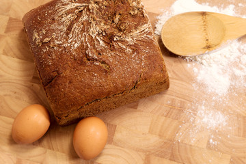 rye bread and eggs on wood