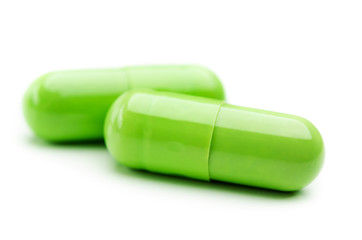 two green capsule isolated