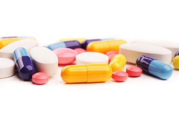 Obraz na płótnie Canvas colored pills isolated