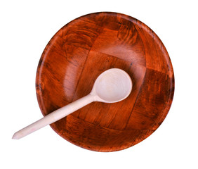 Wood spoon and plate isolated on white