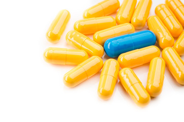 one blue and yellow capsules