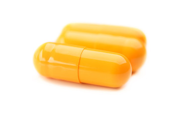 closeup of three yellow pills