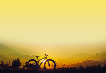 Fototapeta na wymiar mountain bike silhouette on beautiful sunset, silhouette fatbike