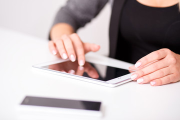 woman works on the digital tablet, soft focus, close up