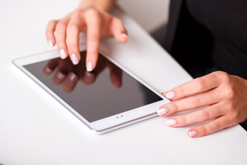 woman works on the digital tablet, soft focus, close up