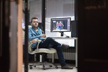 photo editor at his desk