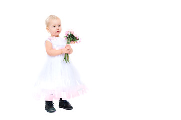 Beautiful little girl with flowers