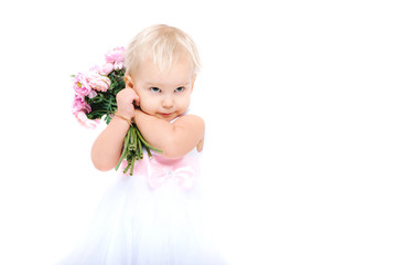 Beautiful little girl with flowers