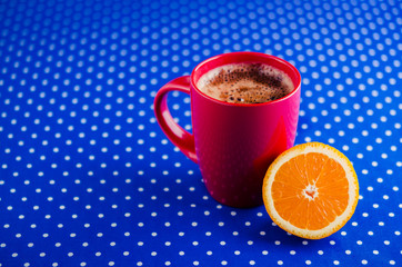 coffee cup and fresh orange