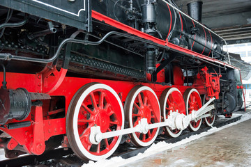 Old black steam locomotive wheels