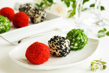 Snack-balls of goat cheese with spices.