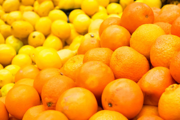 Pile of fresh oranges and lemons