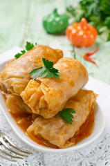 Stuffed cabbage rolls with rice and meat on a white plate