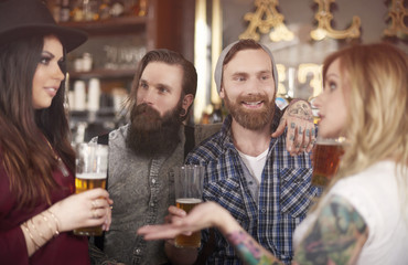 .Lively debate in the pub interior