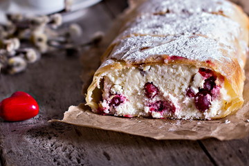 Strudel or pie with cranberries and cheese and two cups of coffee