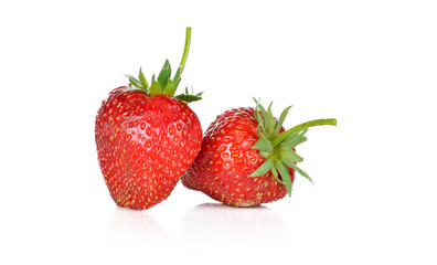 Two strawberries on white background
