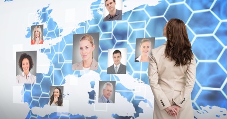 Composite image of rear view of businesswoman