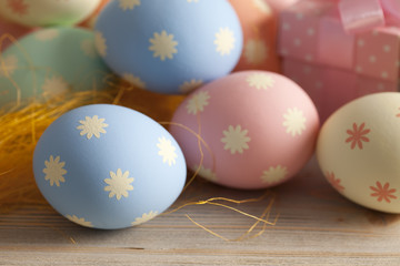 Colored Easter eggs in pastel colors and gift boxes