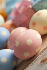 Colored Easter eggs and gift boxes  in pastel colors