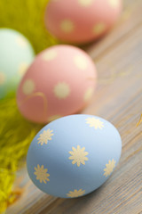 Colorful painted Easter eggs on wooden table
