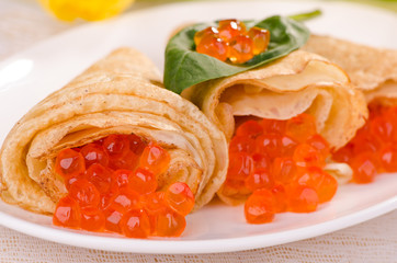 Pancakes with red caviar