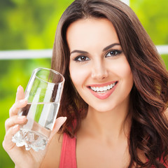 young happy woman with glass of water