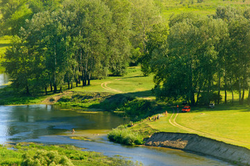 Aerial view at summer river with peopel