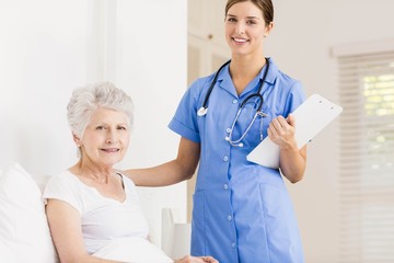 Doctor taking care of suffering senior patient 