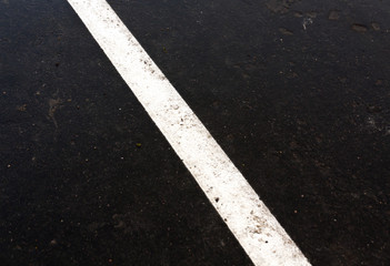 Fototapeta premium Traffic line on dirty ashphalt road