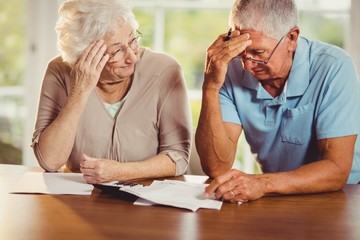 Senior couple counting bills