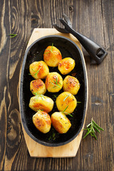 Baked potatoes with rosemary.