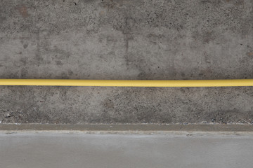 Fototapeta premium yellow PVC pipes for electrical boxes and wires buried on concre