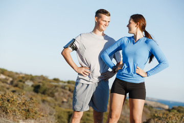 Young couple on beach training together