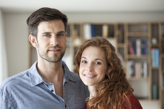 Portrait of smiling couple at home