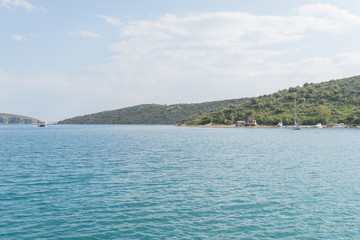 Calm sea and crystal clear water on a greek beach during summer.